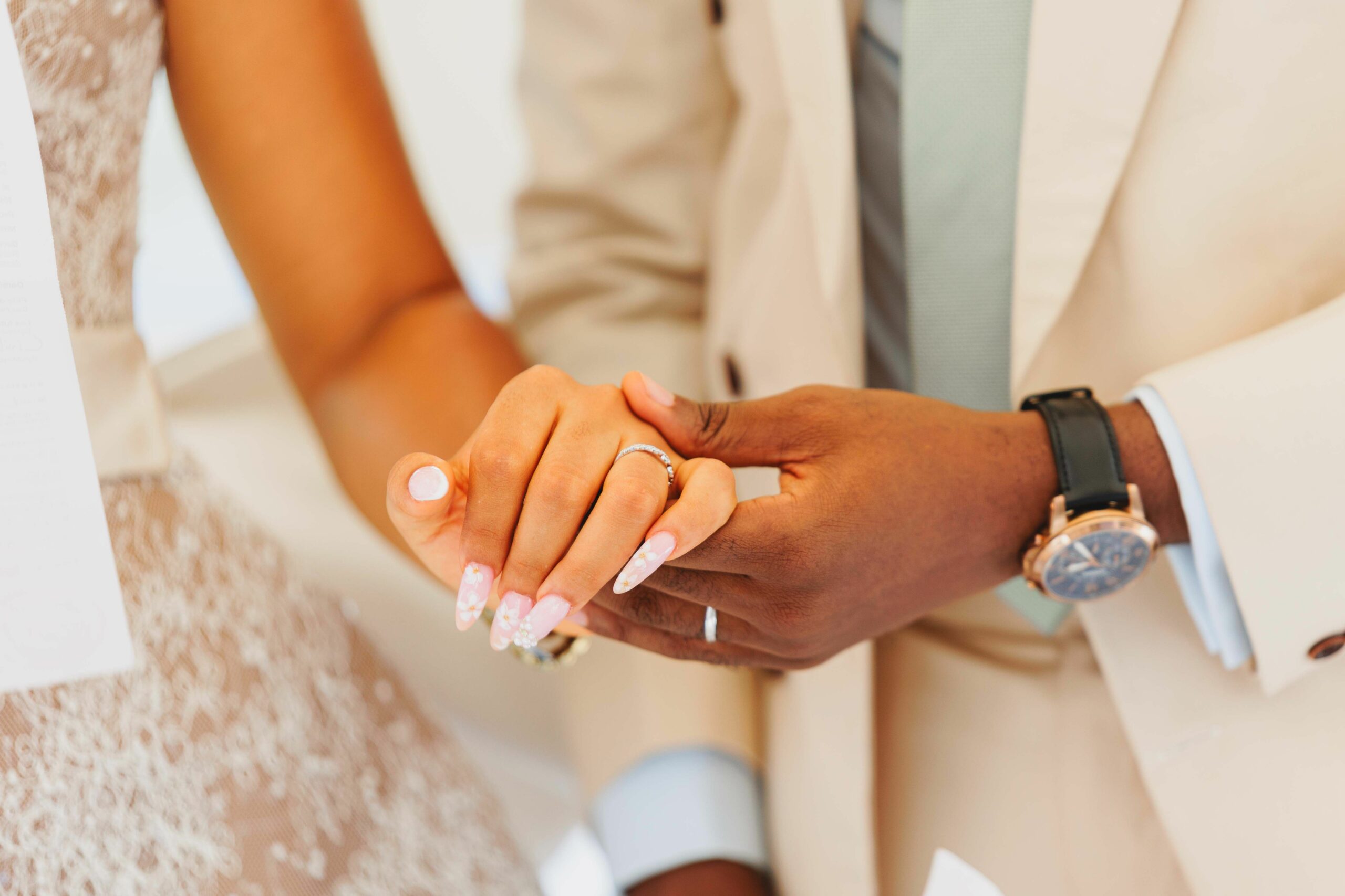Bride and groom holding hands